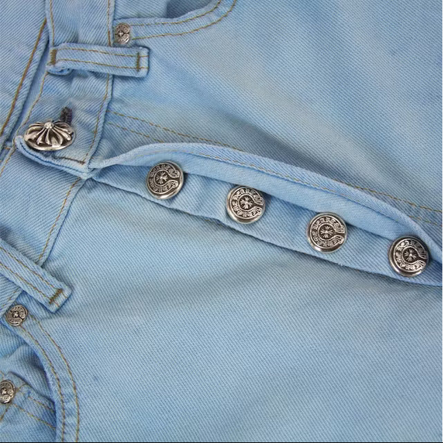 Close-up of leather cross embroidery on jeans