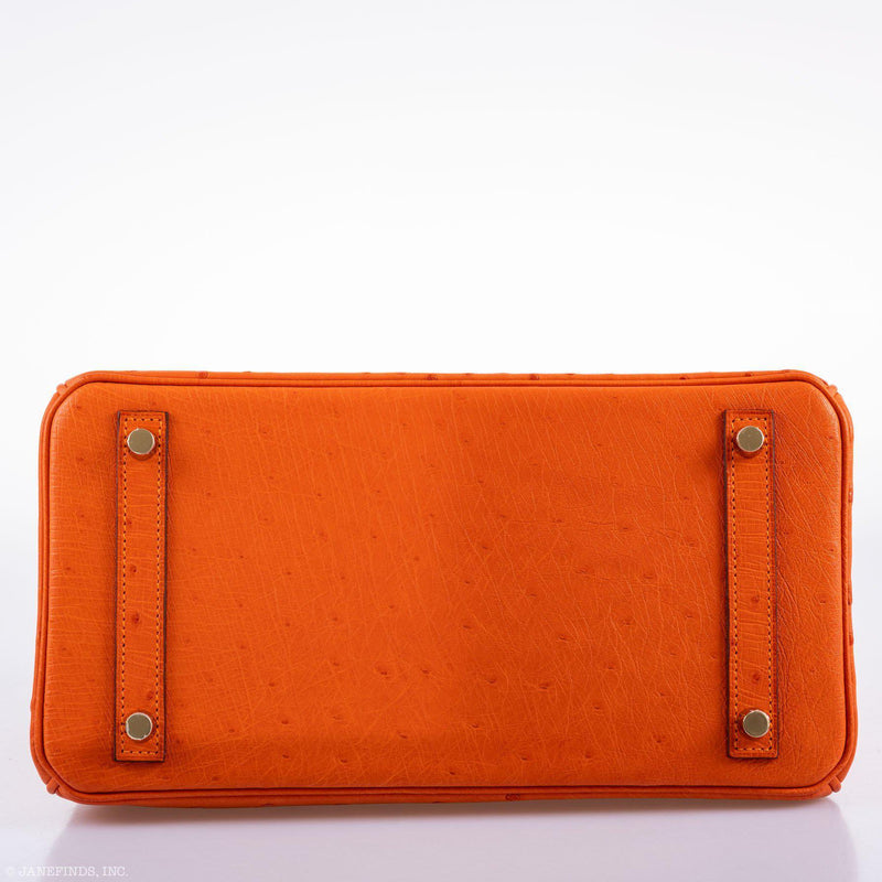 Detailed view of clochette and key holder on bag