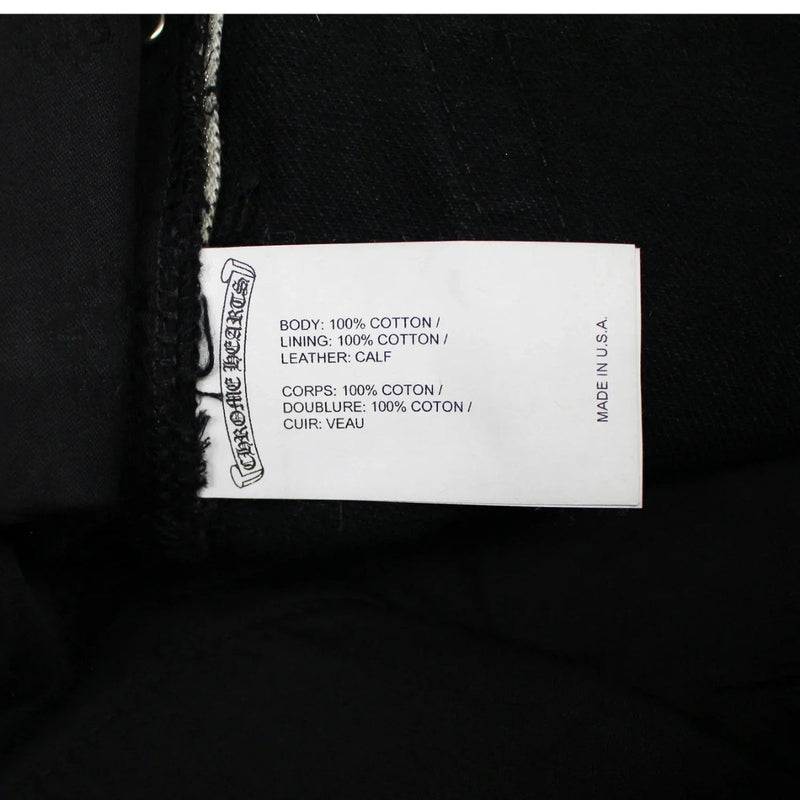 Chrome Hearts jeans with green and leopard cross patches