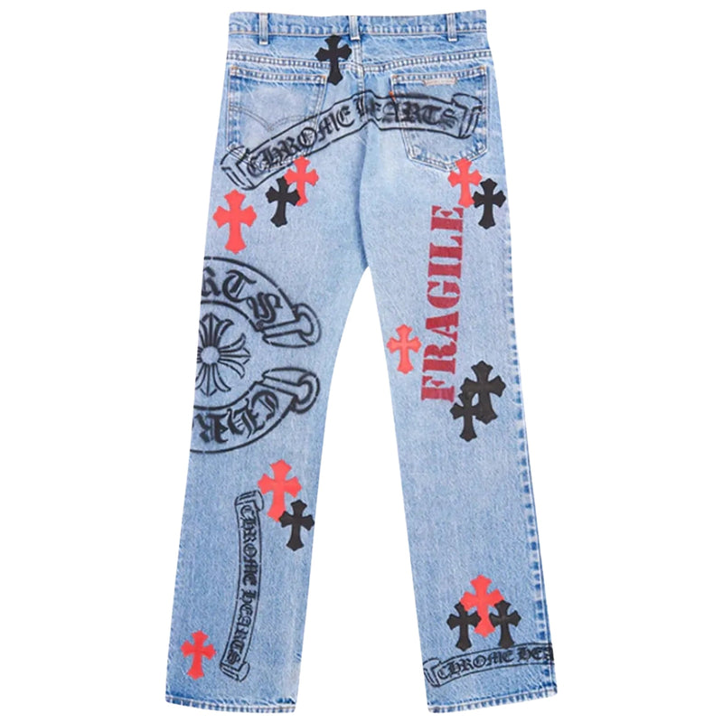 Back view of jeans showing cross patches and rear pocket