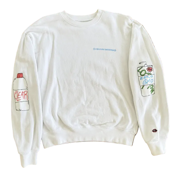 White sweatshirt with graphic designs on a wooden floor