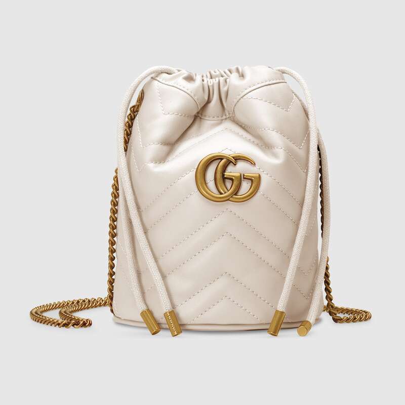 Front view of the Gucci GG Marmont mini bucket bag in white matelassé leather