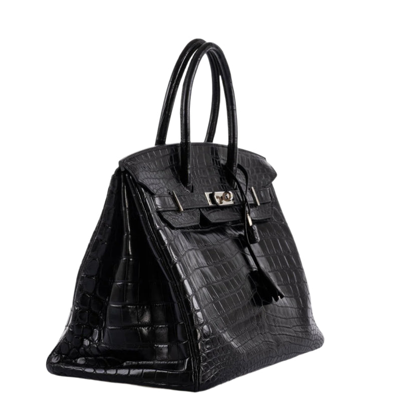 Detail of double rolled top handle on crocodile Birkin