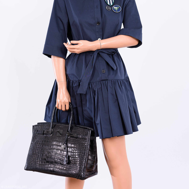 Handle stitching and craftsmanship detail on all-black Birkin