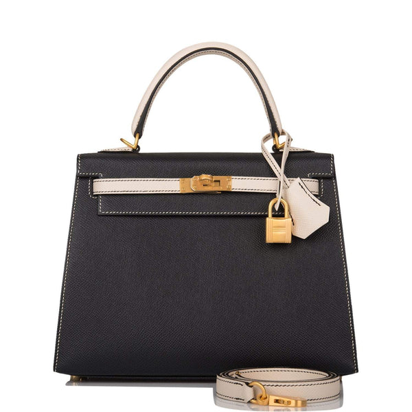 Hermes Kelly 25 Bi-Color Sellier handbag in Black and Craie Epsom leather with brushed gold hardware.

