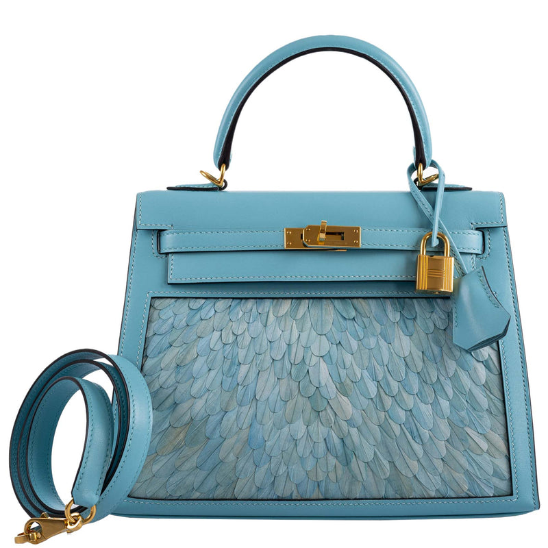 Side profile of Hermes Kelly 25 Blue Atoll bag showing clean Sellier silhouette