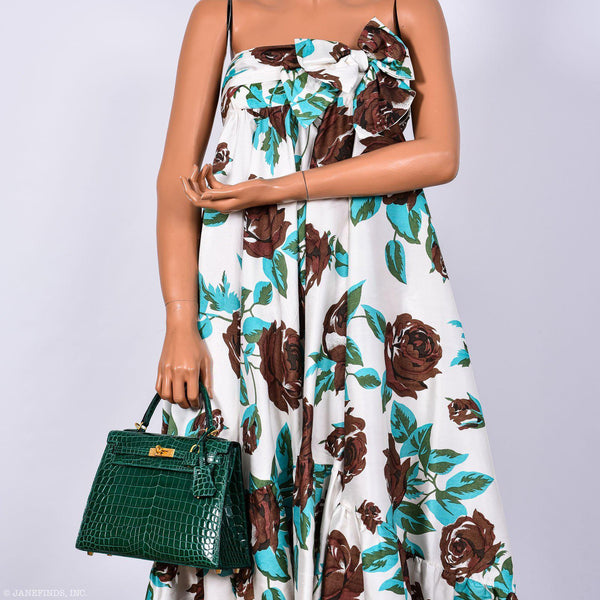 The Hermes Kelly 25 bag shown with its full set of accompanying accessories