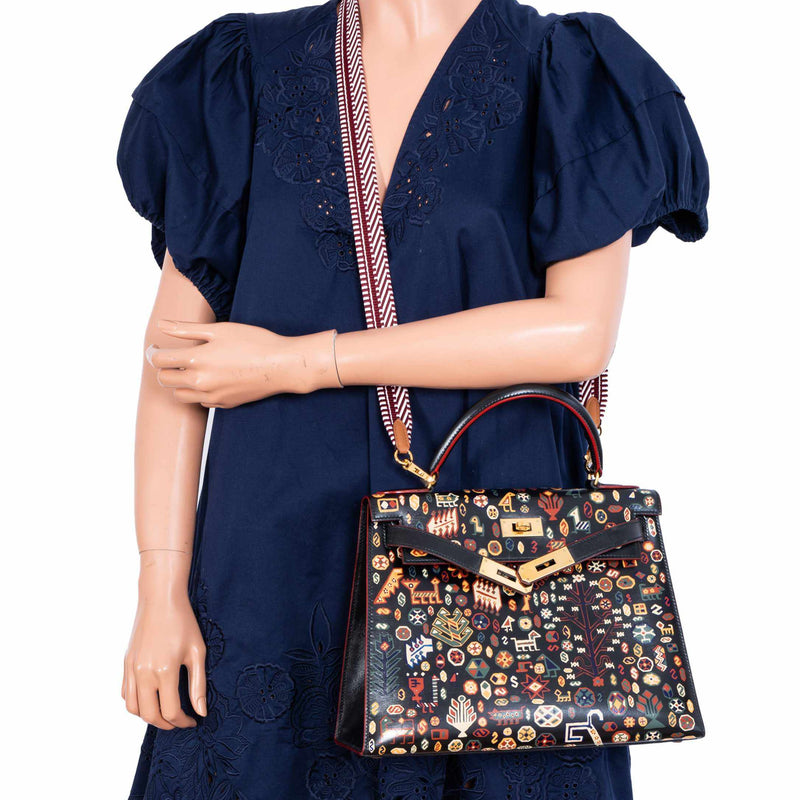 Flatlay of Hermes Kelly 28 with artistic painted motif
