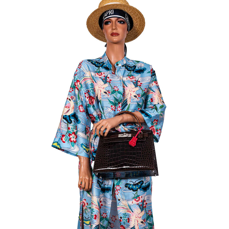 A close-up shot of the symmetrical scales on the shiny Macassar alligator