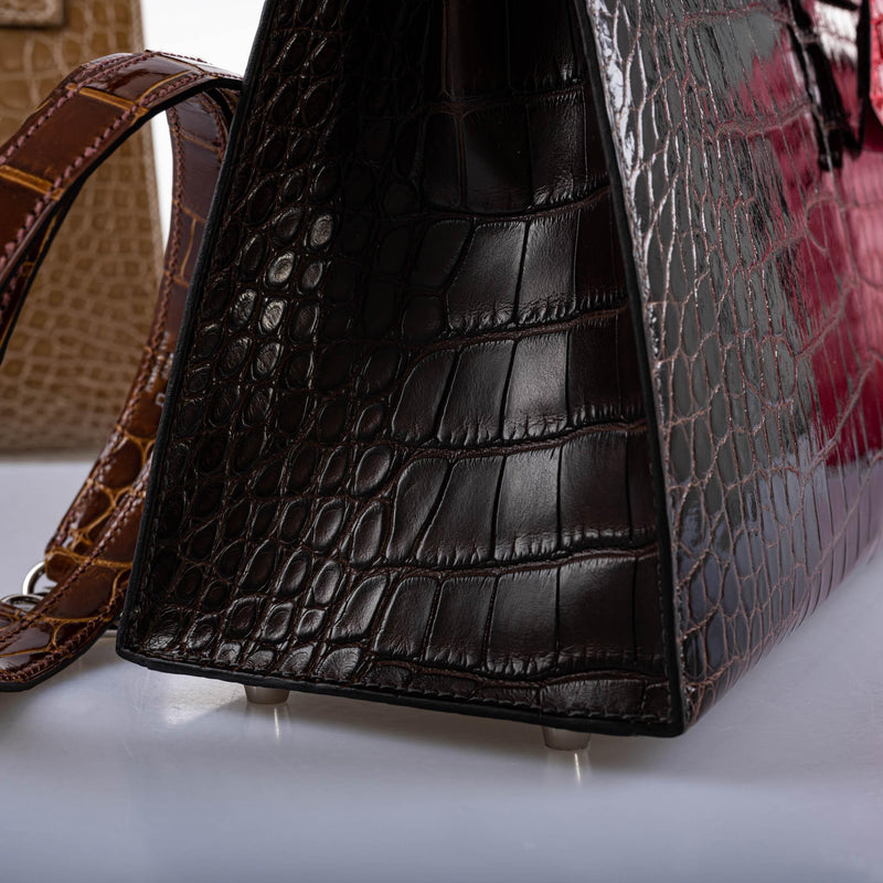 A detail of the stitching on the structured Sellier bag