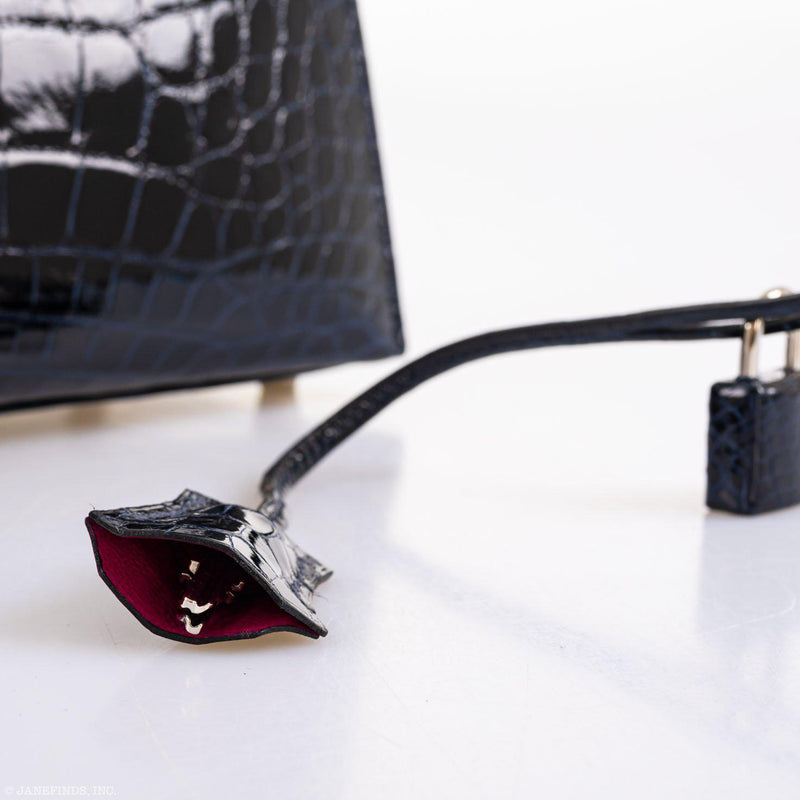 The side gusset of the bag shown with the strap