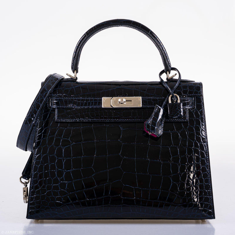 The bag shown with its dustbag and box