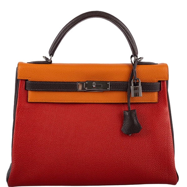 Hermes Kelly 32 Retourne handbag in tri-color Orange H, Rouge Vif, and Ebene Togo leather with Ruthenium hardware