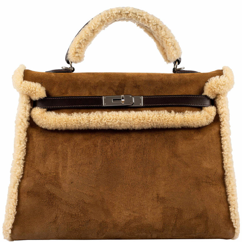 Hermes Kelly 35 Retourne handbag in Teddy Shearling and Ebene Barenia leather with palladium hardware.

