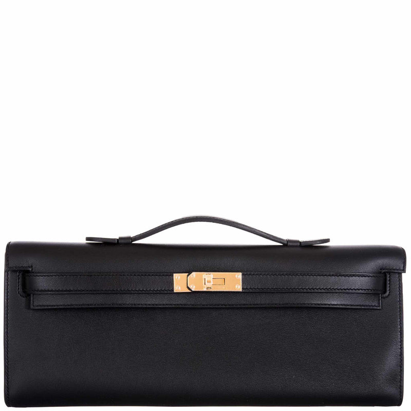 Front view of Hermes Kelly Cut clutch in black Swift leather with gold hardware.