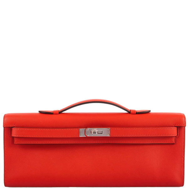 Hermes Kelly Cut clutch bag in Capucine Swift leather with palladium hardware.