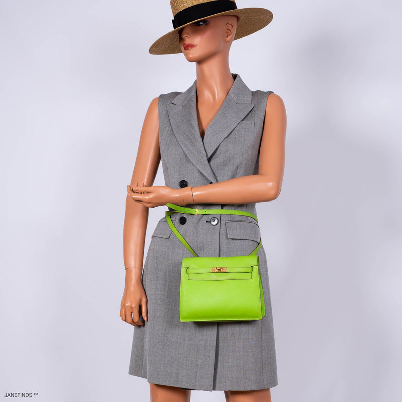 Angled view of Hermes Kelly Danse II Vert Cru Swift leather with gold hardware