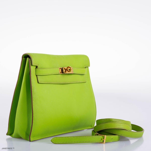 Side profile of Hermes Kelly Danse II apple green Swift leather bag.