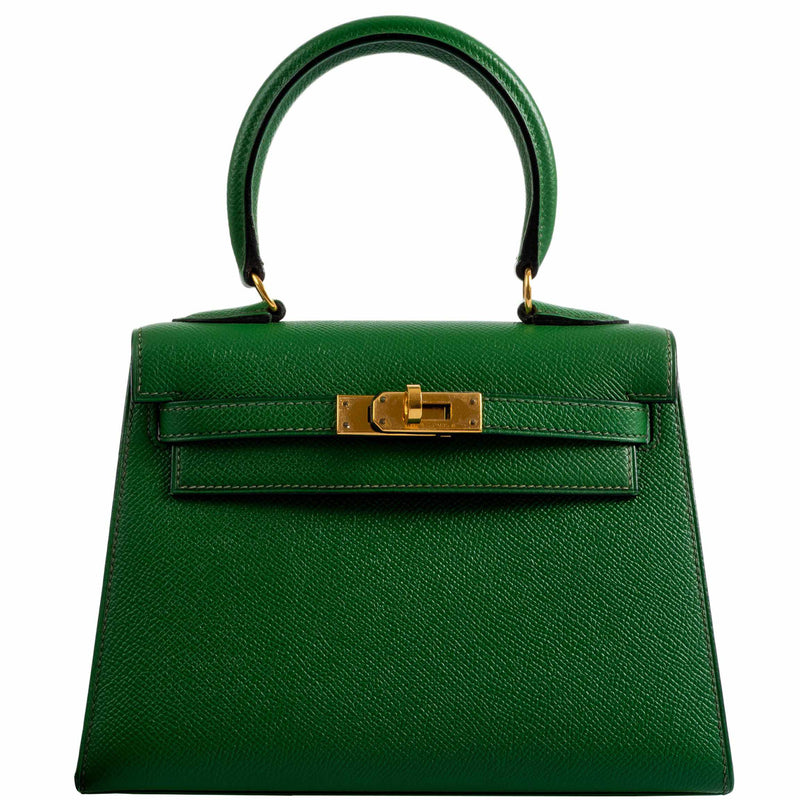 A detailed view of the gold-tone clasp and turn-lock closure on the Hermes Kelly Mini Pochette