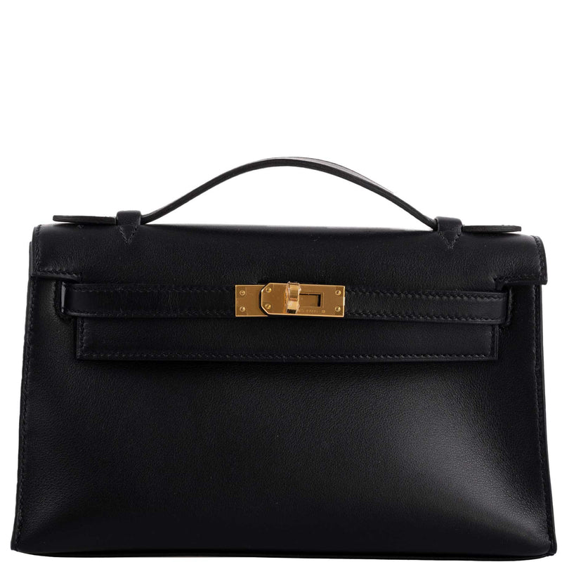 The clochette, lock, and keys in gold-tone hardware for the Hermes Kelly Mini Pochette