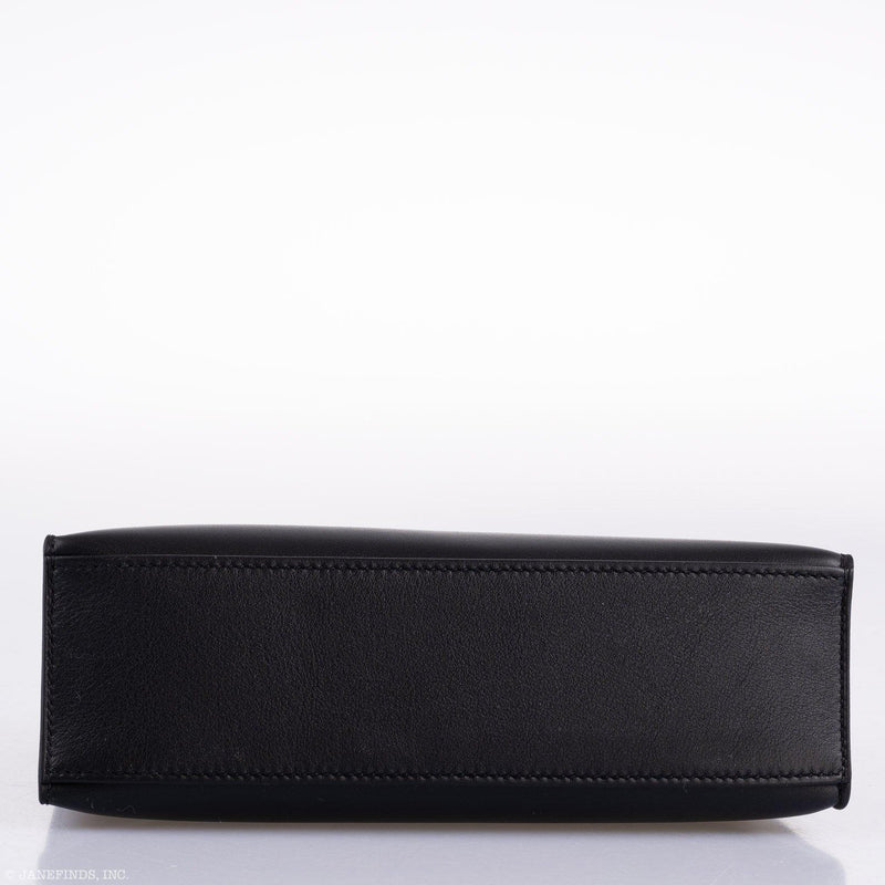 A shot focused on the front closure straps and the gold-tone turn-lock