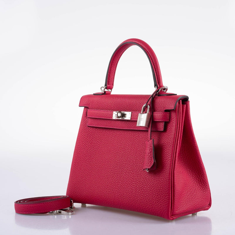 A view of the clochette and palladium hardware lock set for the Kelly bag