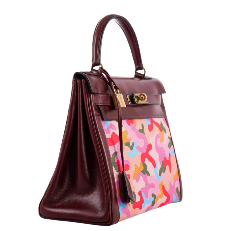 Close-up of neon camouflage painting on toile canvas panel