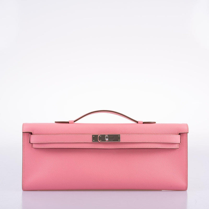 Side profile of Kelly Cut clutch in pink Epsom leather