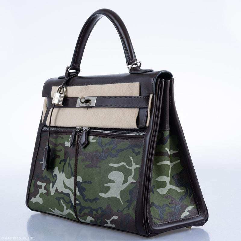 Styled shot of vintage Hermes Kelly Lakis 35 in artistic camouflage setting