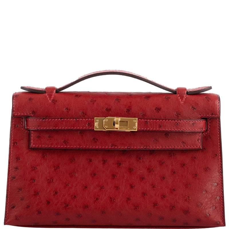 Front view of Hermes Kelly Mini Pochette in Rouge Vif ostrich leather with gold hardware