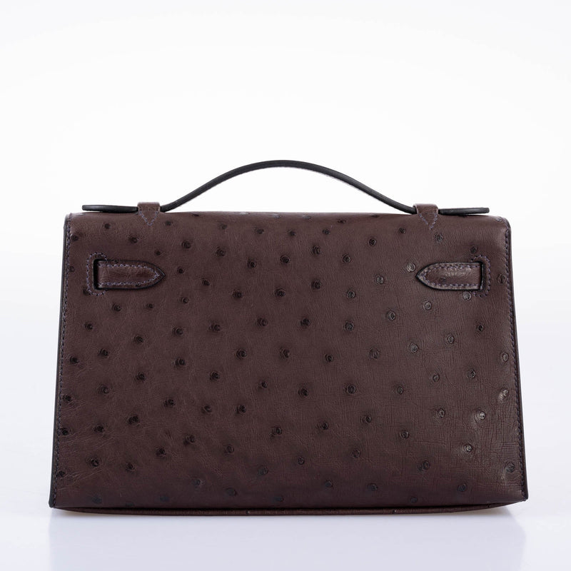 Top handle and flap detail with tonal stitching