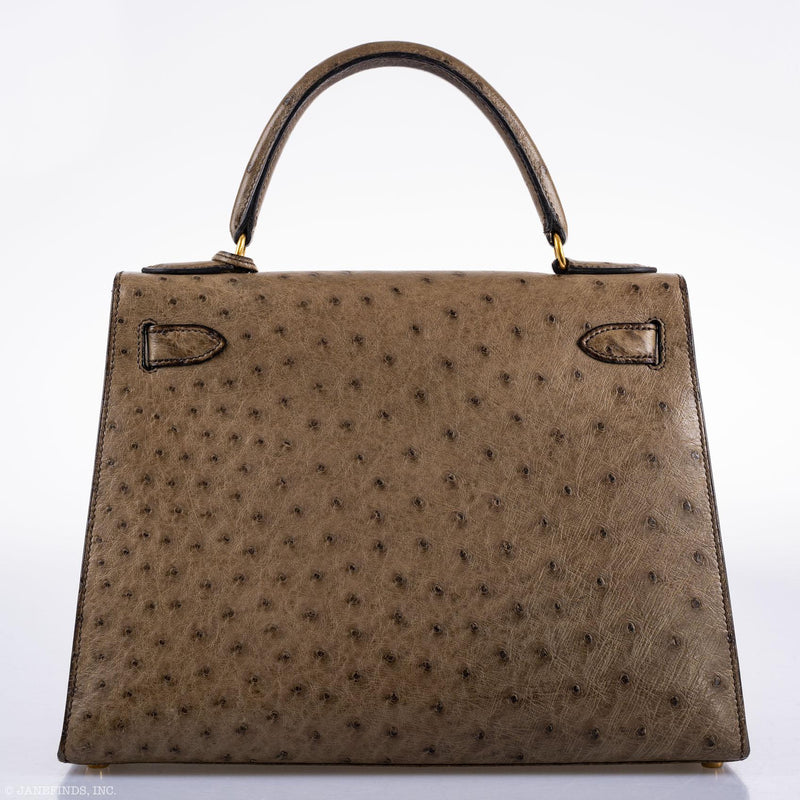 Rolled handle and gold strap attachment

