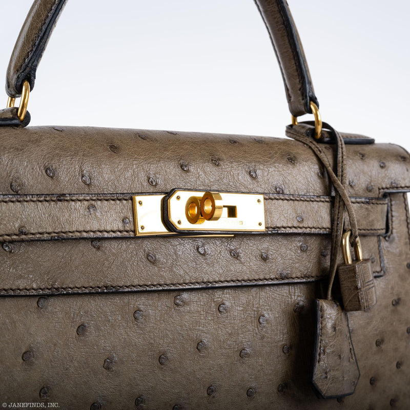 Chevre-lined interior with zip and slip pocket

